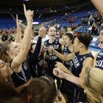 The BYU Lady Cougars Basketball team celebrates a victory