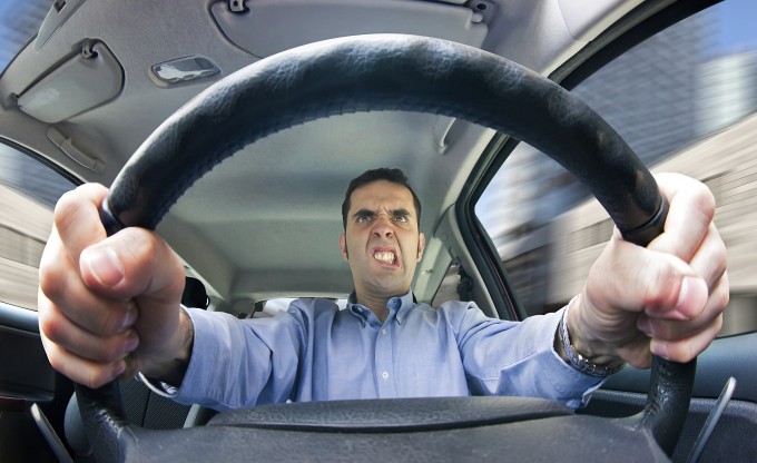 Man driving angrily