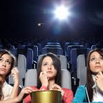 3 women watch a sad movie