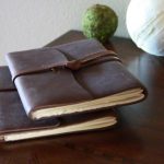 Leather bound journals on a desk
