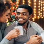 man and woman drinking hot chocolate at home