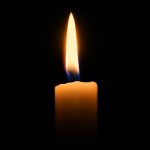 a candle with black background