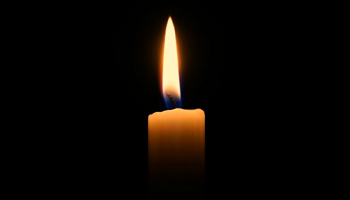 a candle with black background
