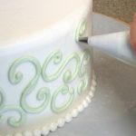 decorating a wedding cake