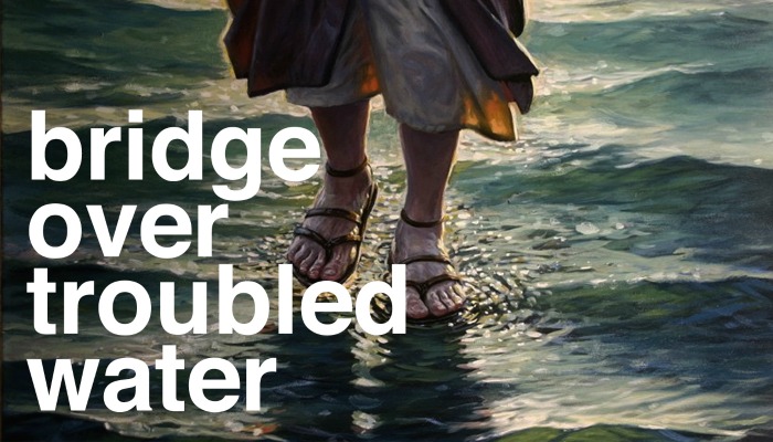 Painting of Christ's feet, with the text "Bridge Over Troubled Water" on it.