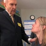 Photo of President Nelson visiting a woman in the hospital.
