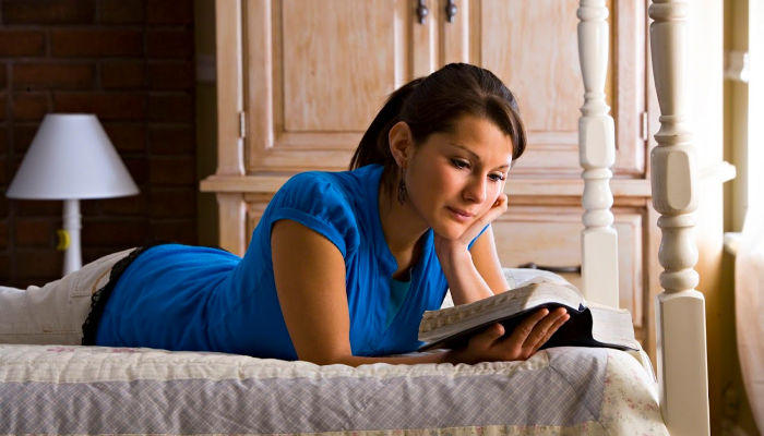 young woman studying scripture
